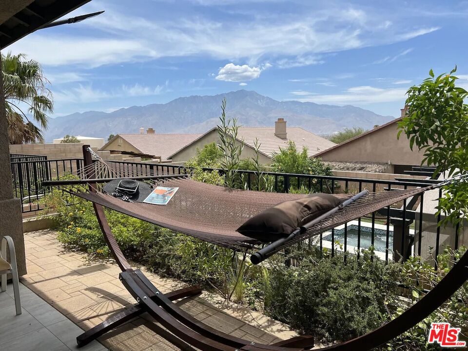 a view of balcony with wooden floor and outdoor seating