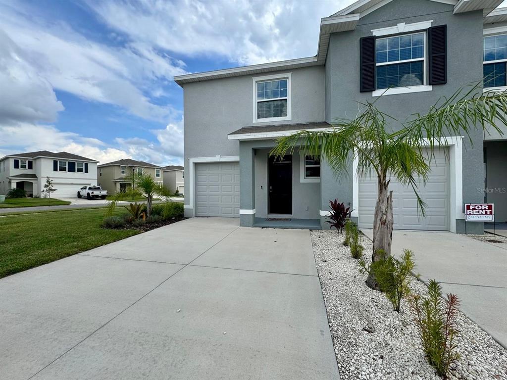 a view of house with yard and outdoor space