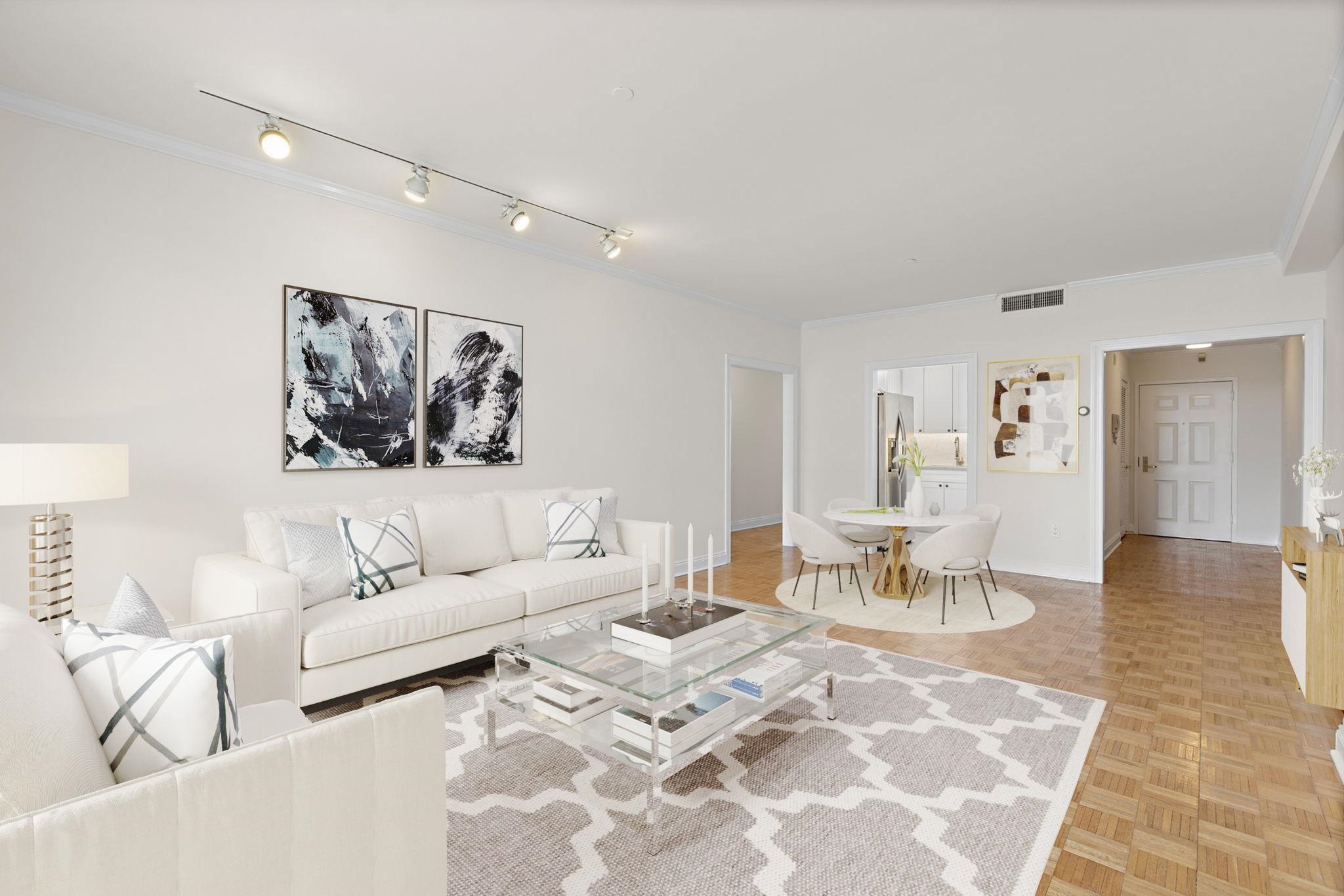 a living room with furniture and view of kitchen