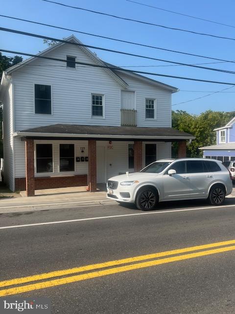 a view of a car parked front of a house