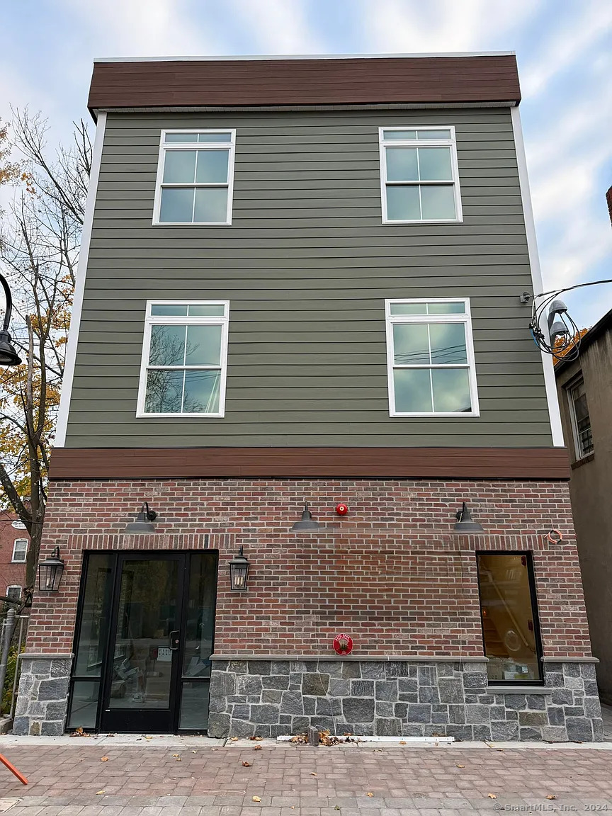 a front view of a house with stairs