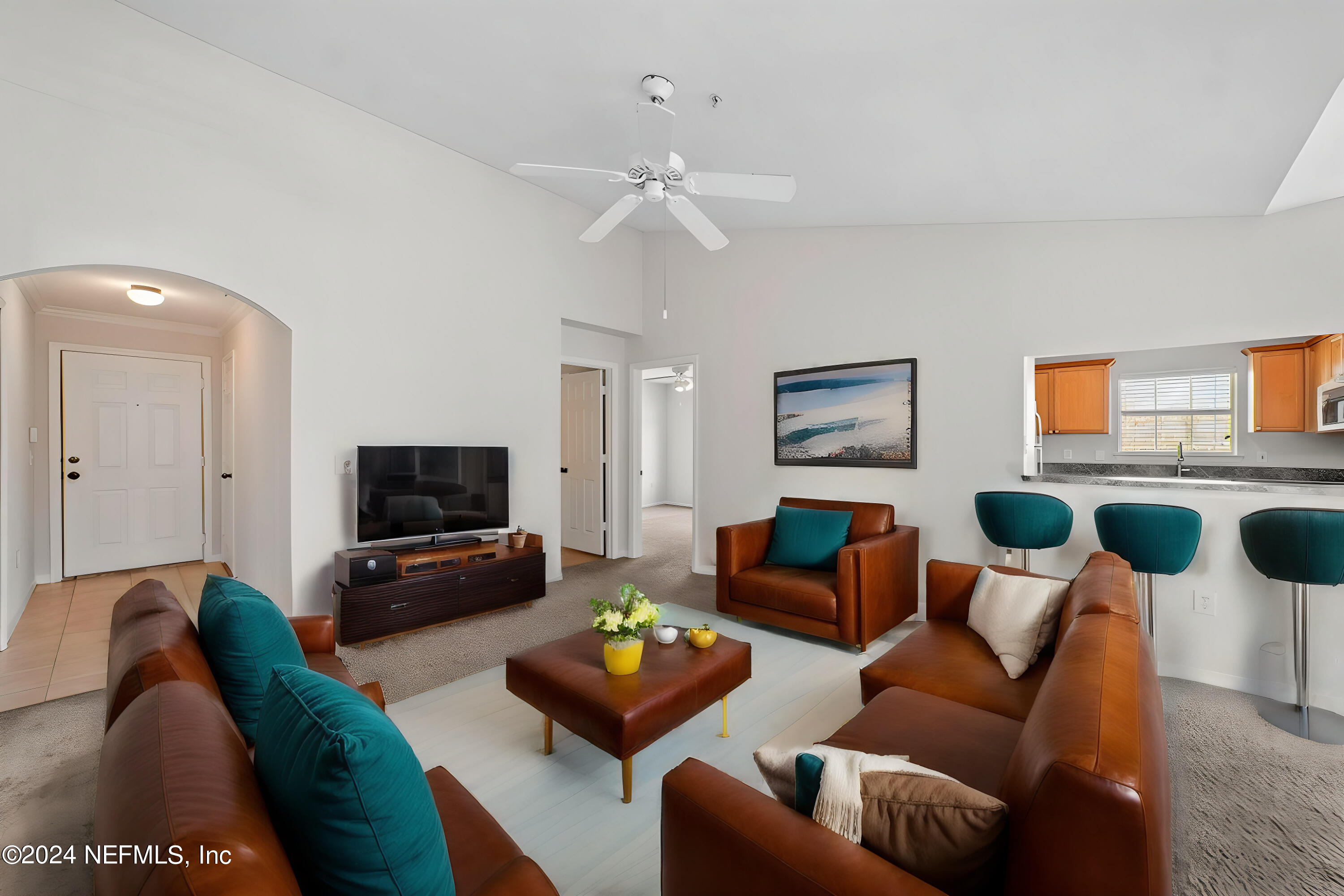 a living room with furniture and a flat screen tv