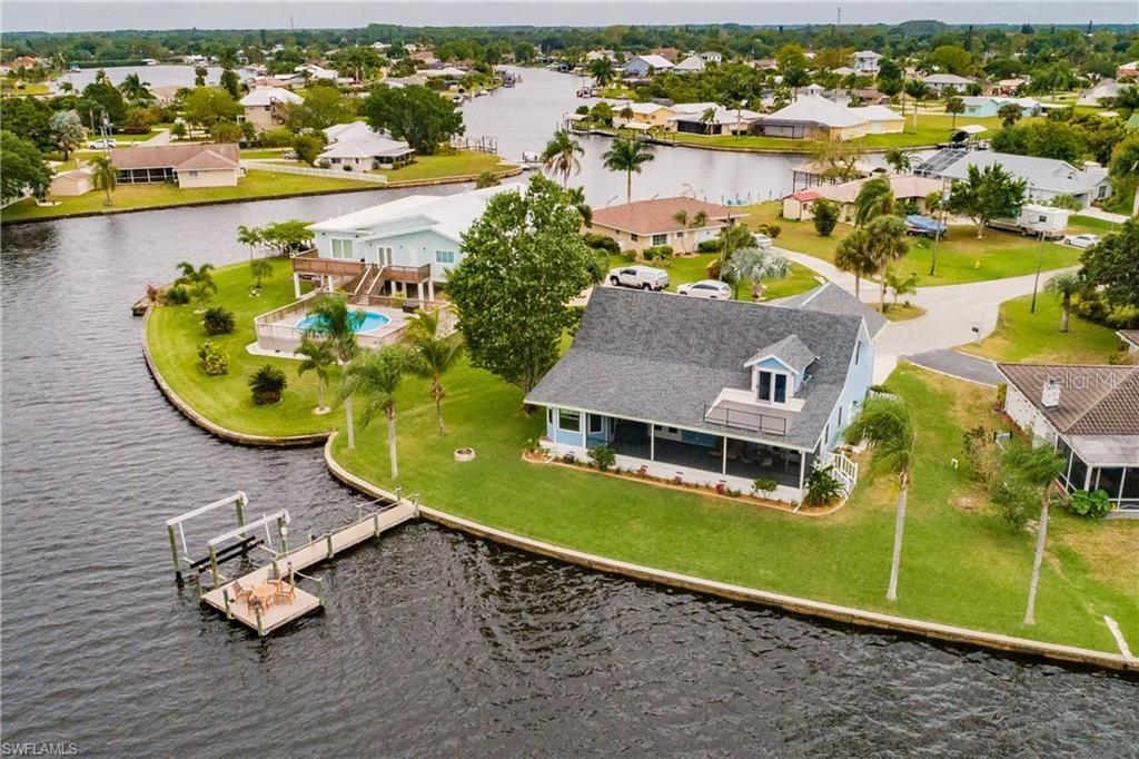 an aerial view of a house with a ocean view