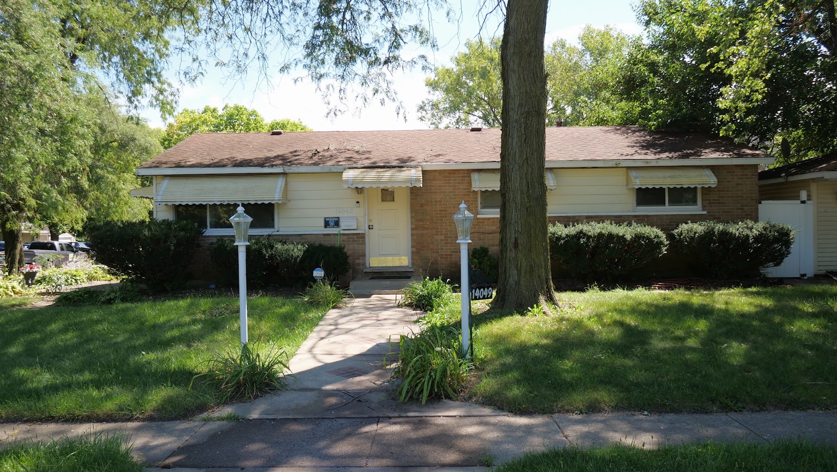 a front view of a house with garden