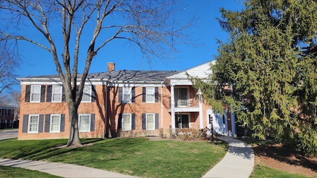 front view of house with a yard