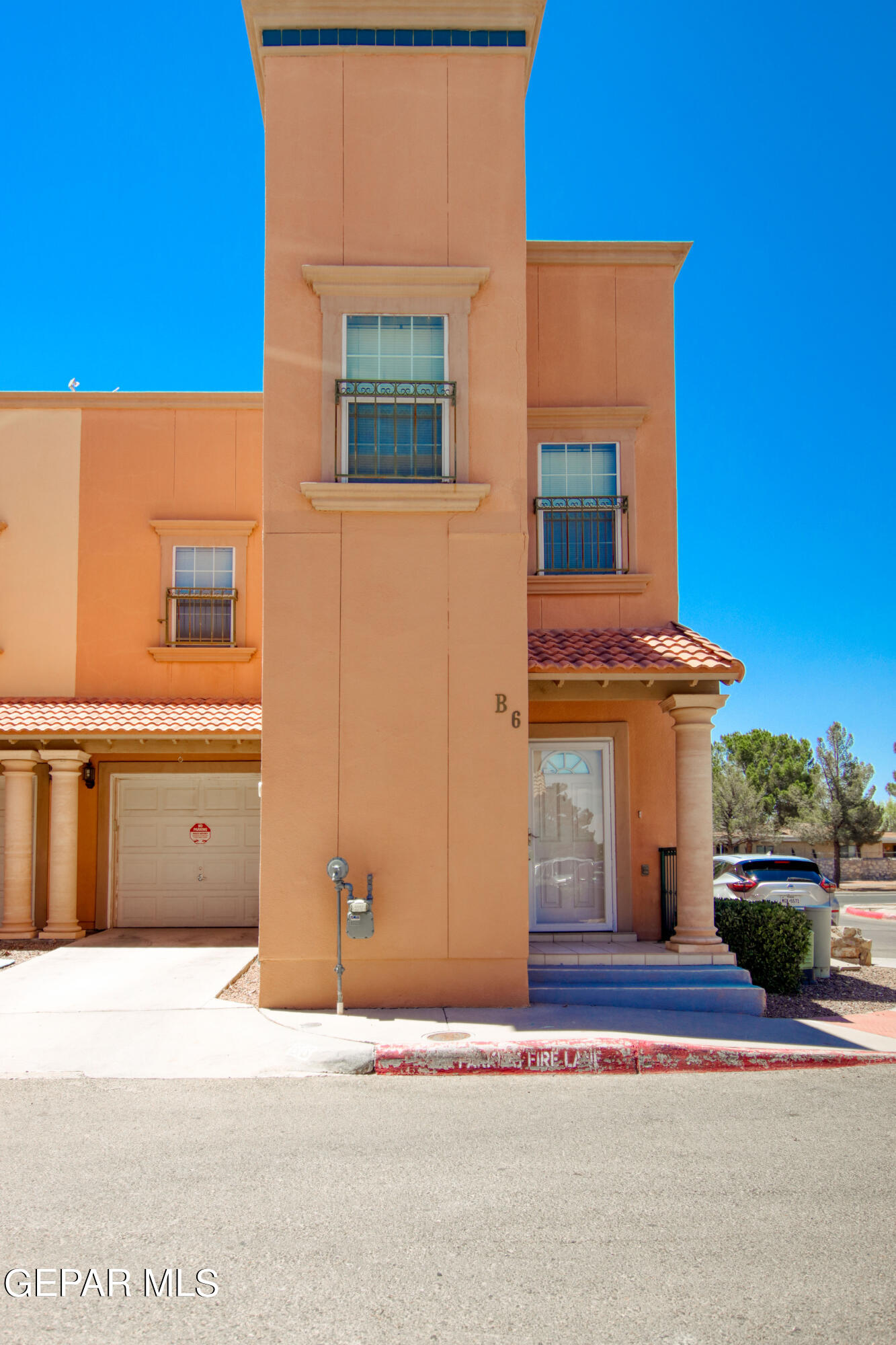 a front view of a house with a garage