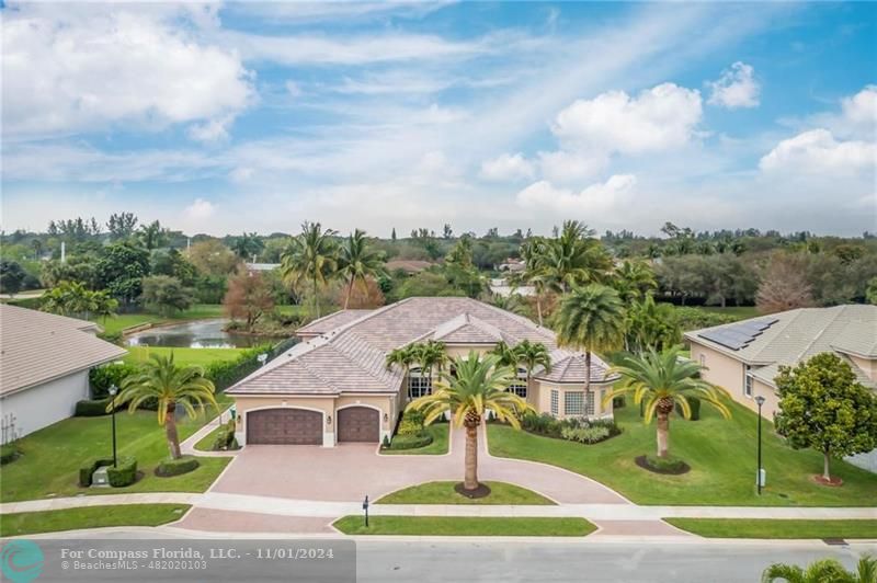 a aerial view of a house with a yard