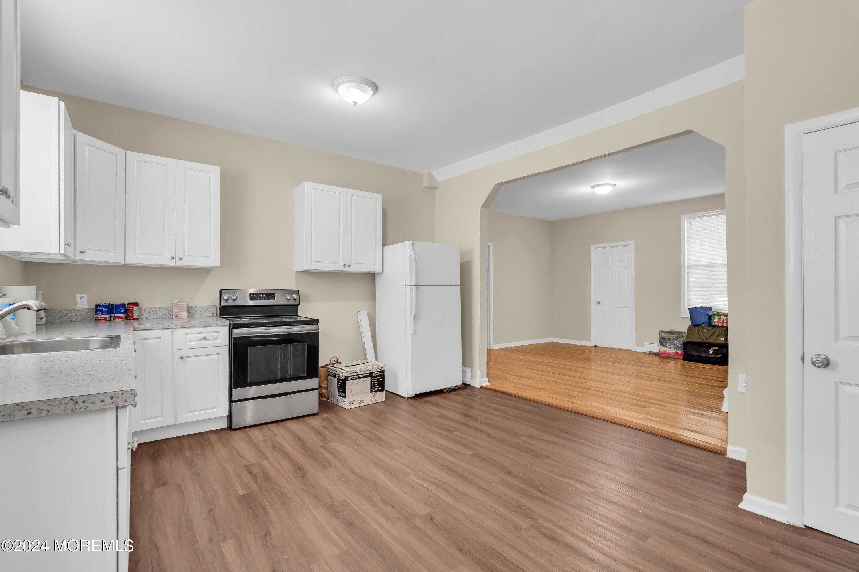 a kitchen with stainless steel appliances a refrigerator and a stove top oven