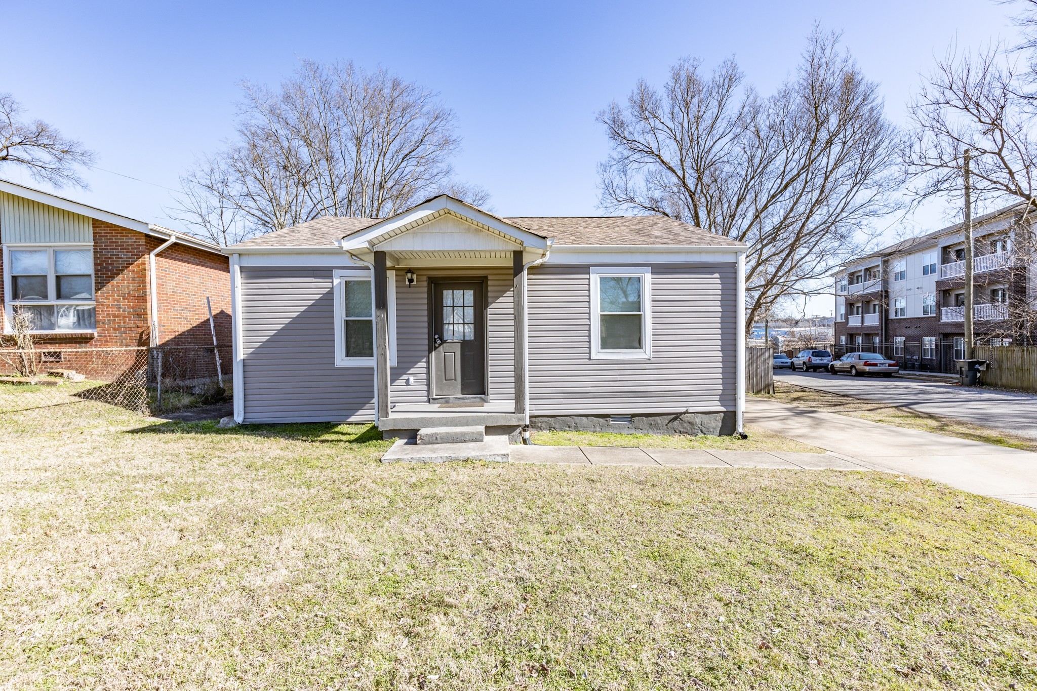 a front view of a house with a yard