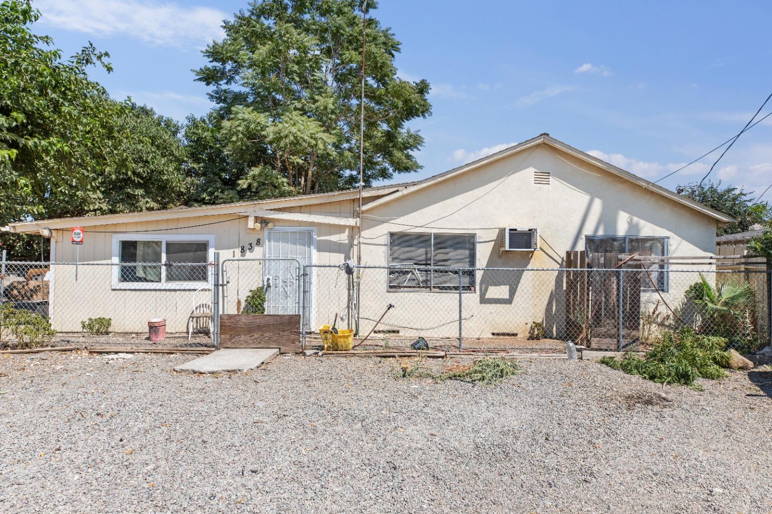 a view of a house with backyard and sitting area