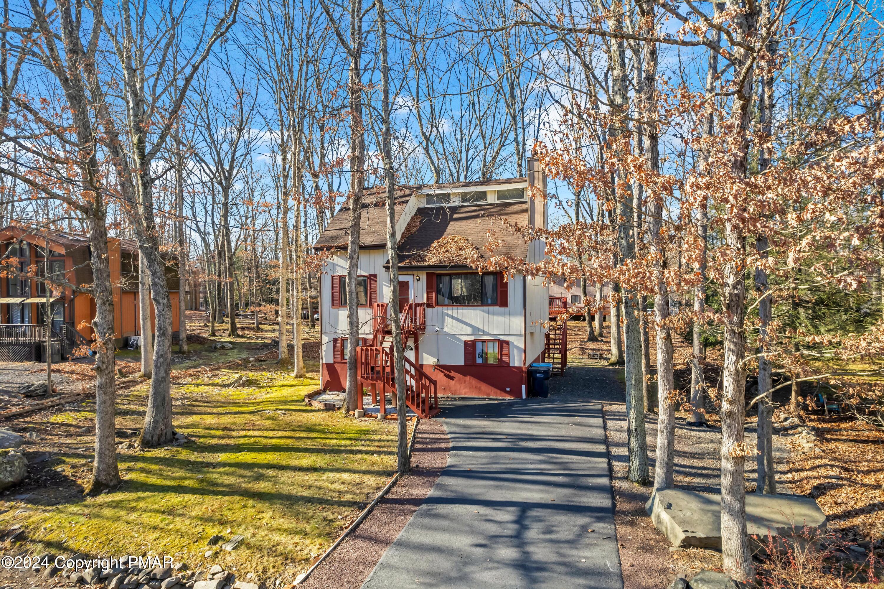 a view of a yard with an outdoor seating