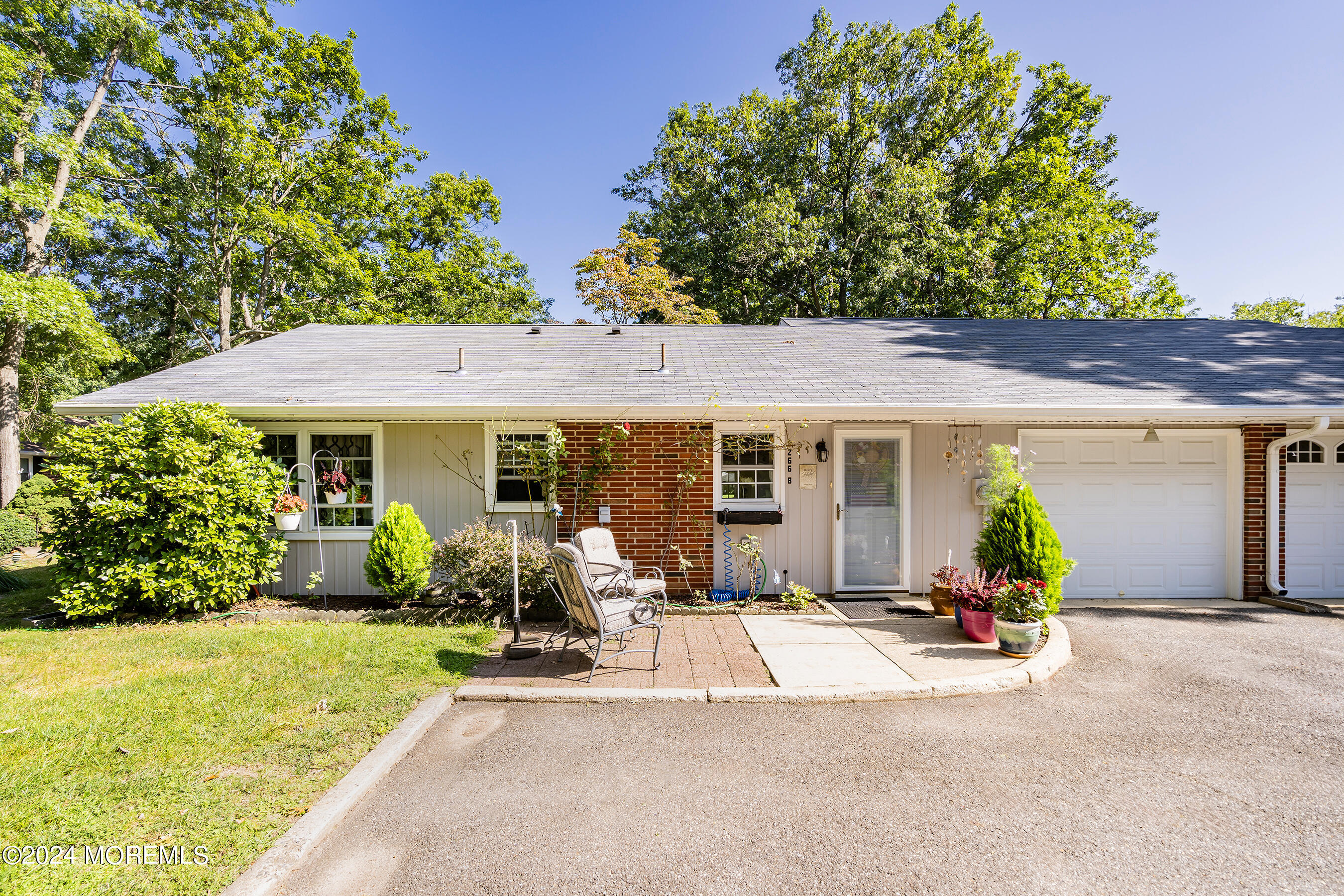 a view of a house with backyard porch and sitting area