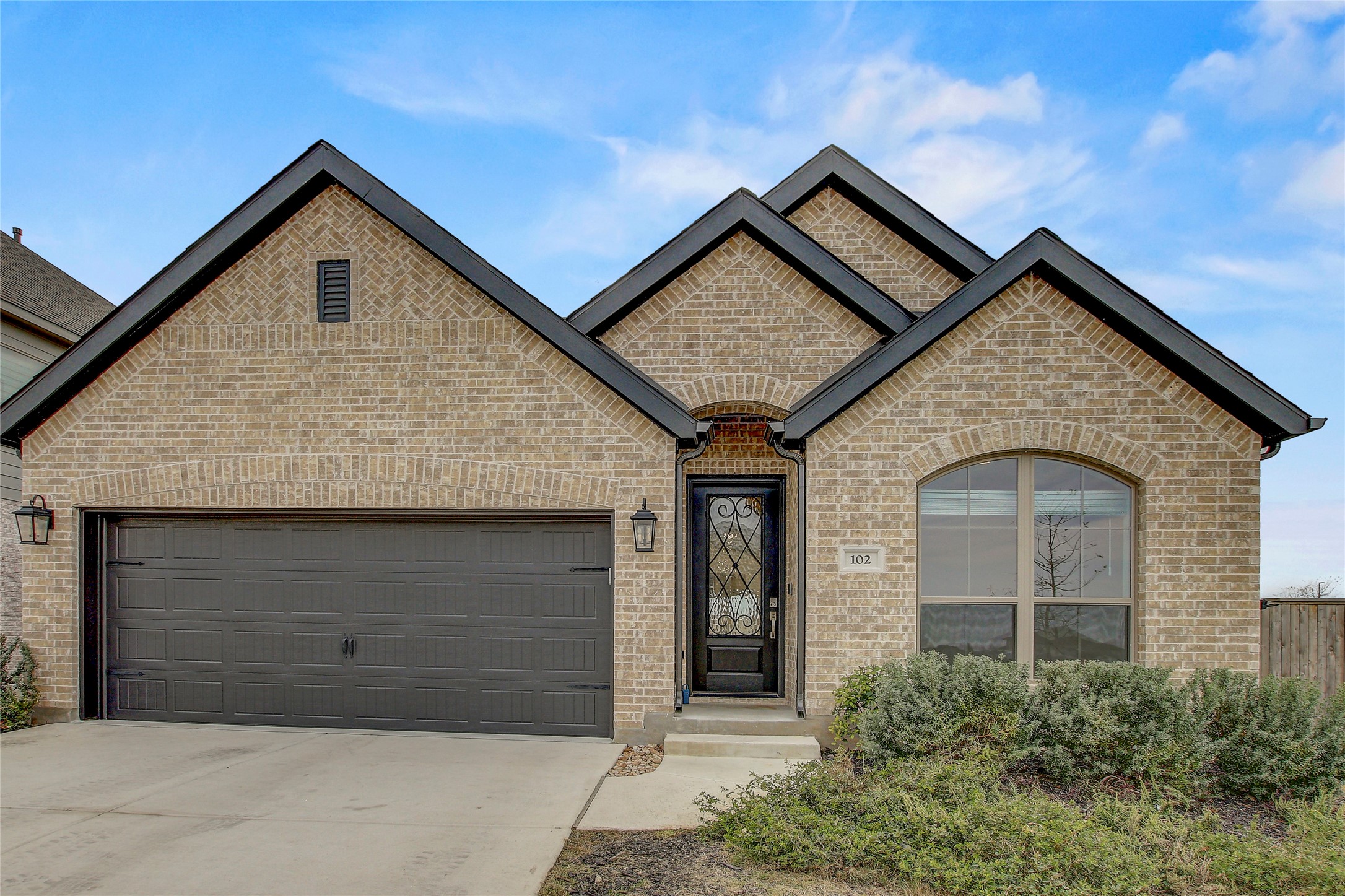 a front view of a house with a garage