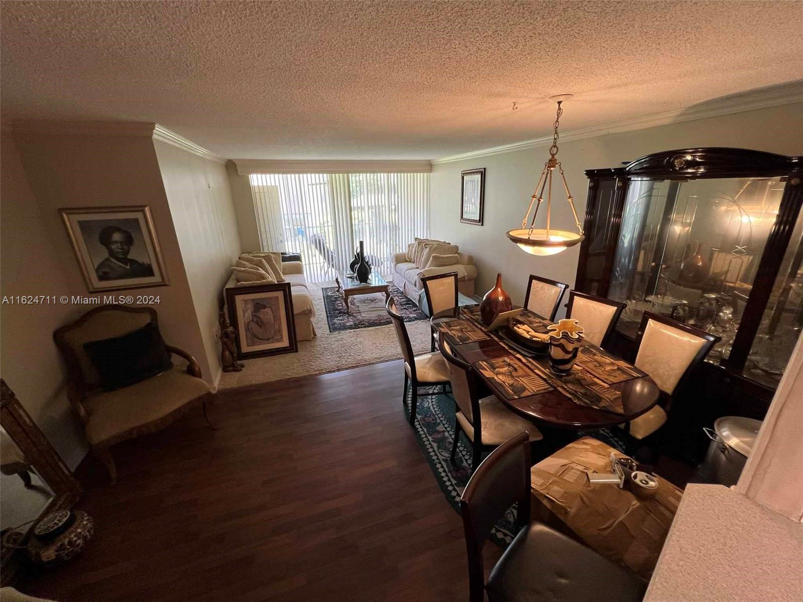 a view of a livingroom with furniture and a flat screen tv