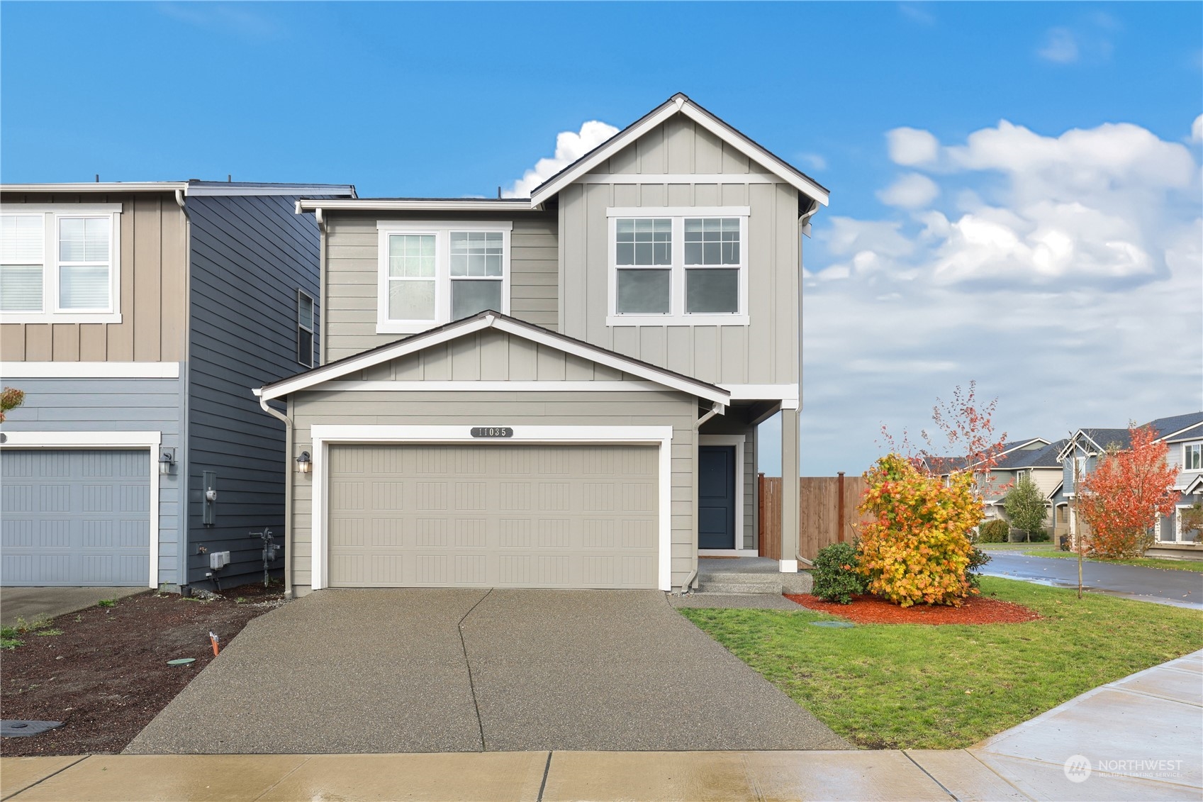 a front view of a house with a yard