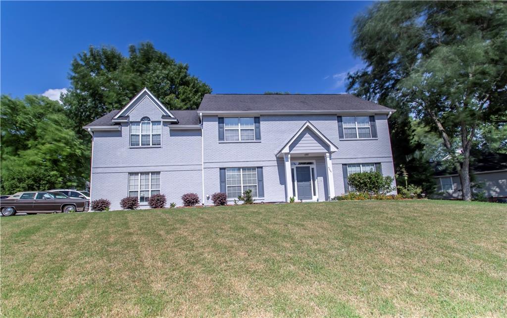 front view of a house with a yard