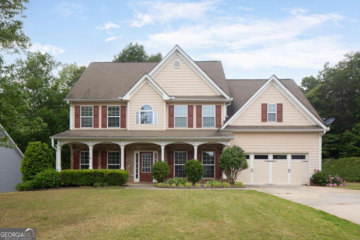 a front view of a house with a yard