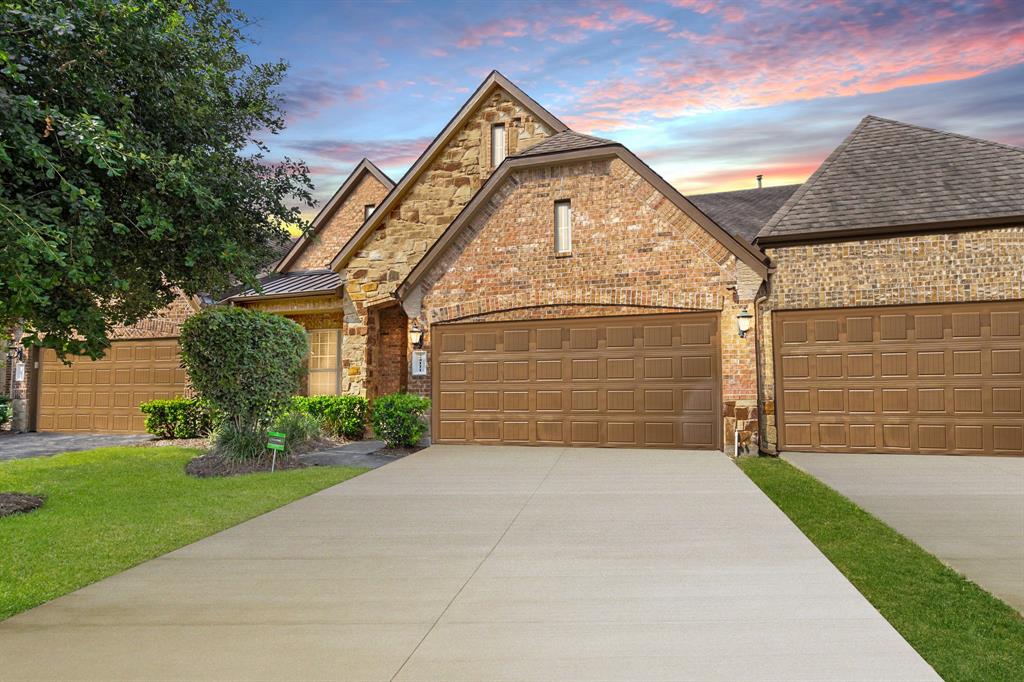 Welcome home to 24111 Valencia Ridge Ln! Notice the well-manicured lawn, stunning stone/brick elevation,  beautiful outdoor lanterns, and a double wide driveway!