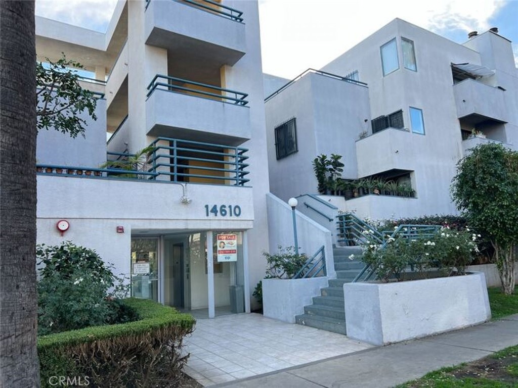 an aerial view of a house with entryway and plants