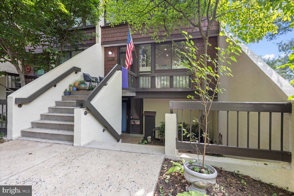 a front view of house with deck and outdoor seating