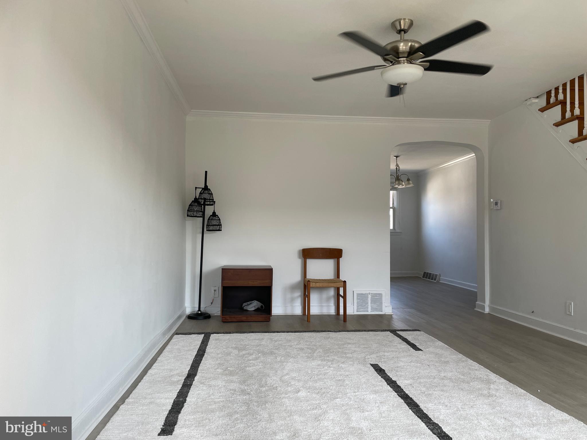 a view of a livingroom with a fireplace and a workspace