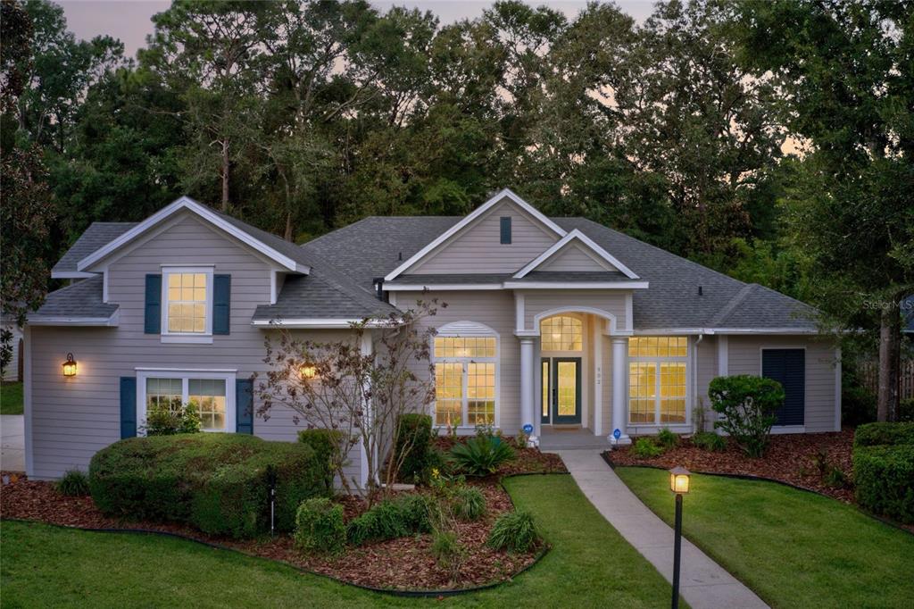 a front view of a house with a yard