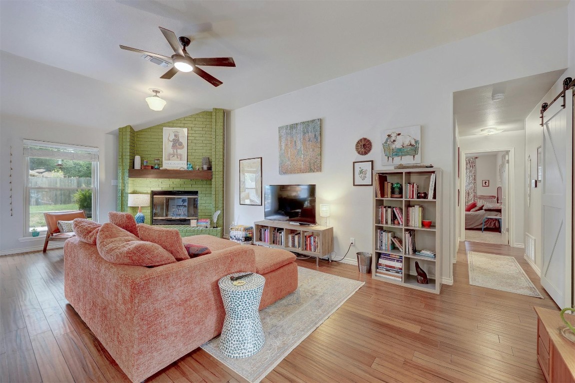 Luxury vinyl plank flooring seamlessly guides you through the open-concept living space, kitchen, and breakfast nook