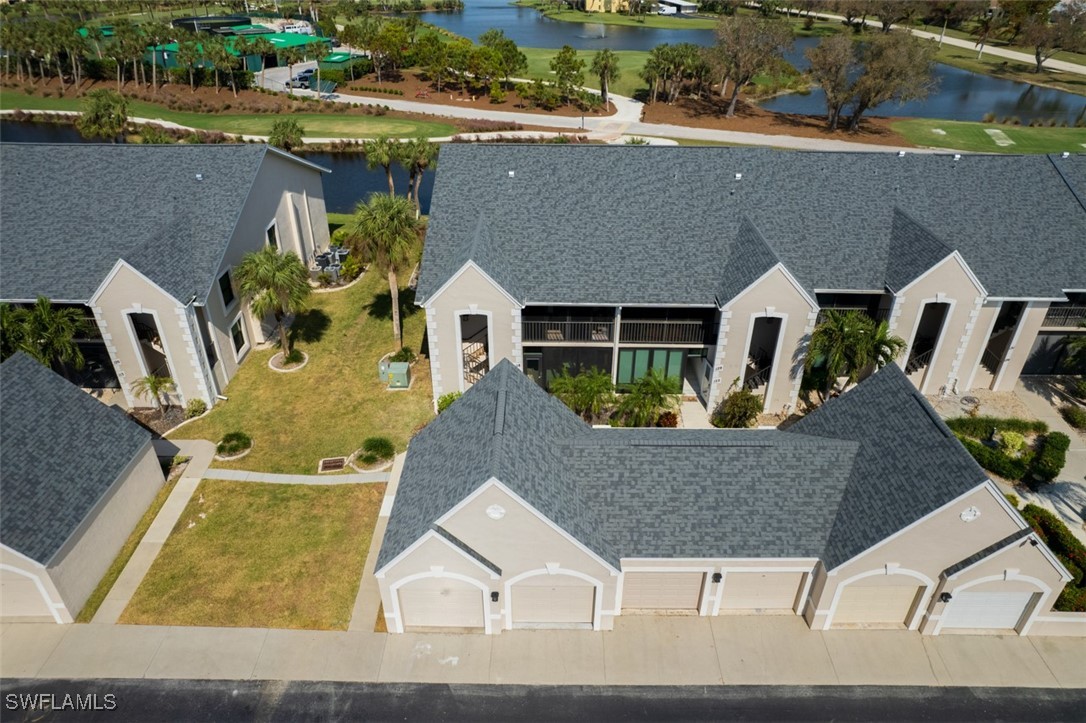 an aerial view of a house with outdoor space and lake view