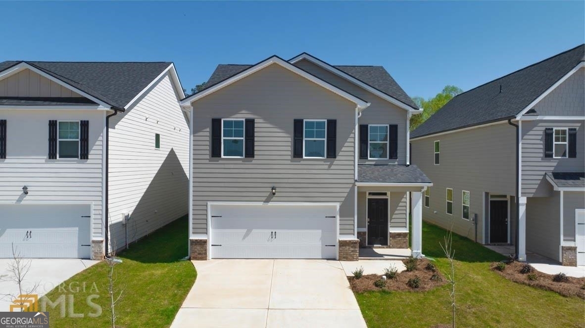 a front view of a house with a yard