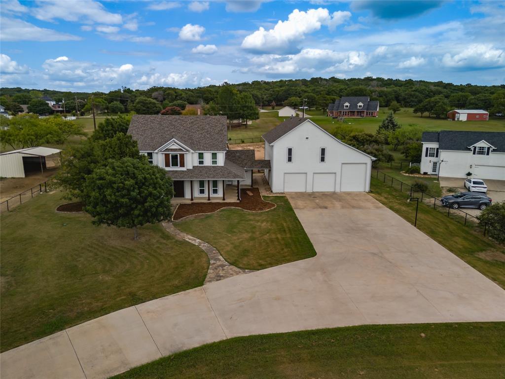 a view of house with a yard