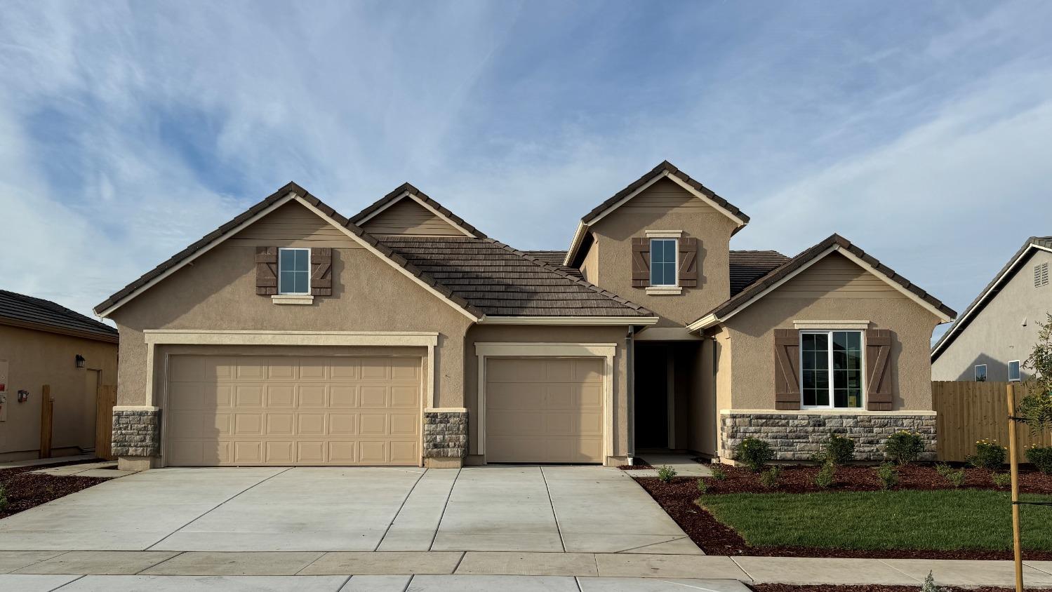 a front view of a house with yard