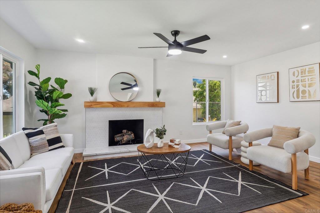 a living room with furniture and a fireplace