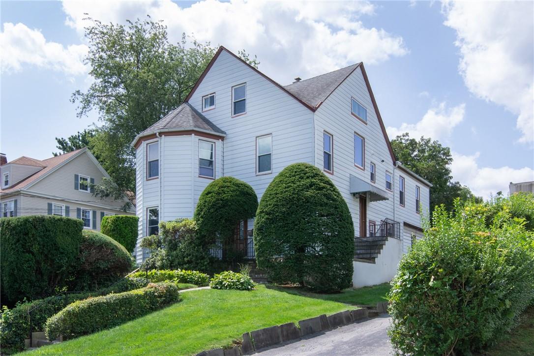 View of front of property with a front lawn