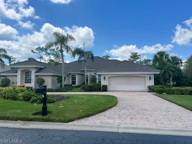 a view of a house with a yard