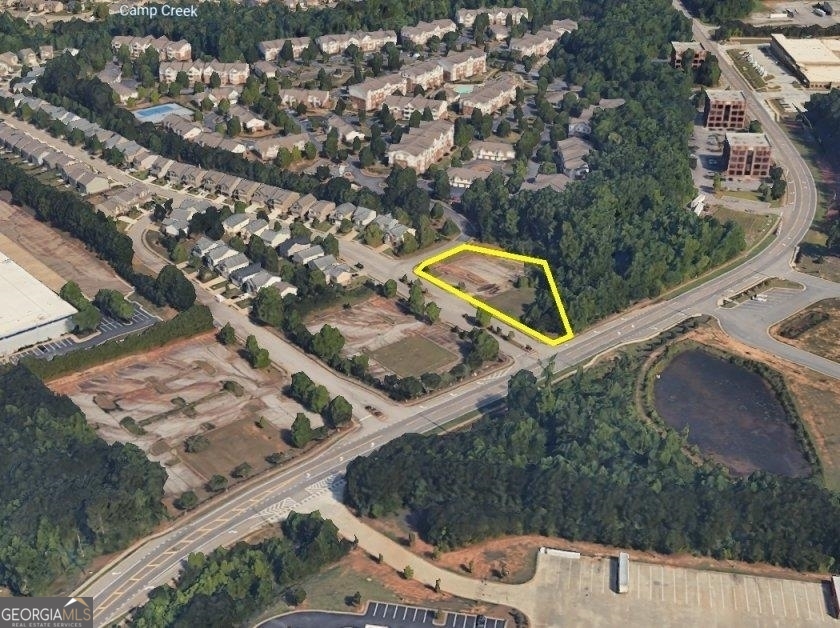 an aerial view of a house with a swimming pool