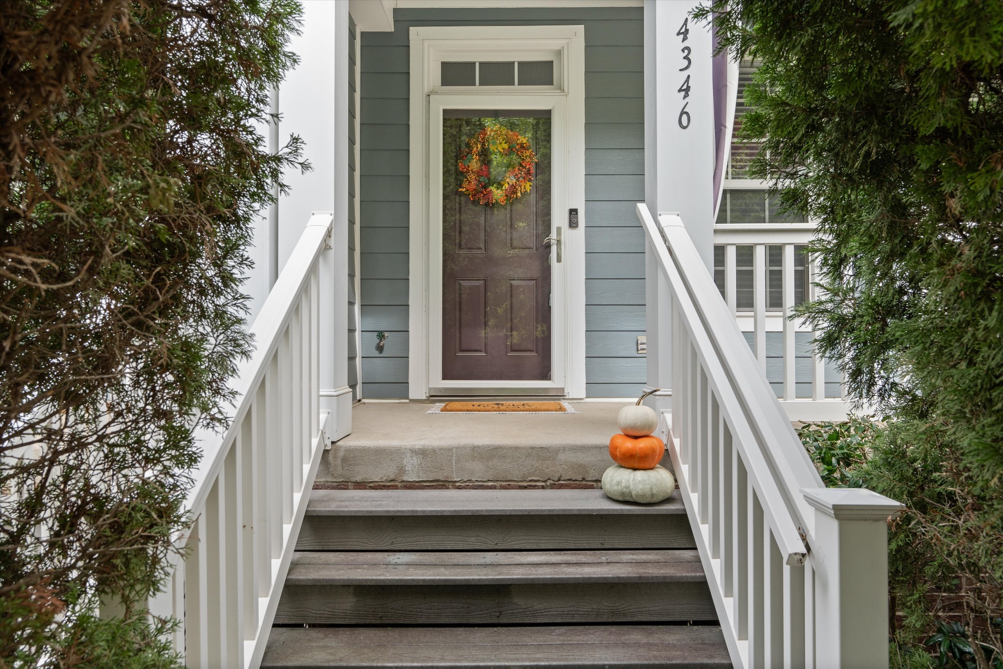 a stairs of the house with a small yard