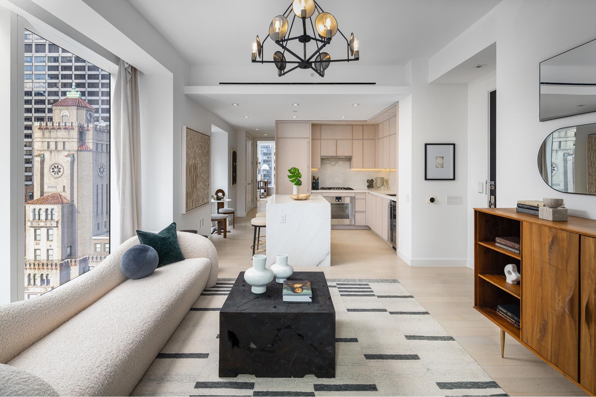 a living room with furniture a rug and white walls