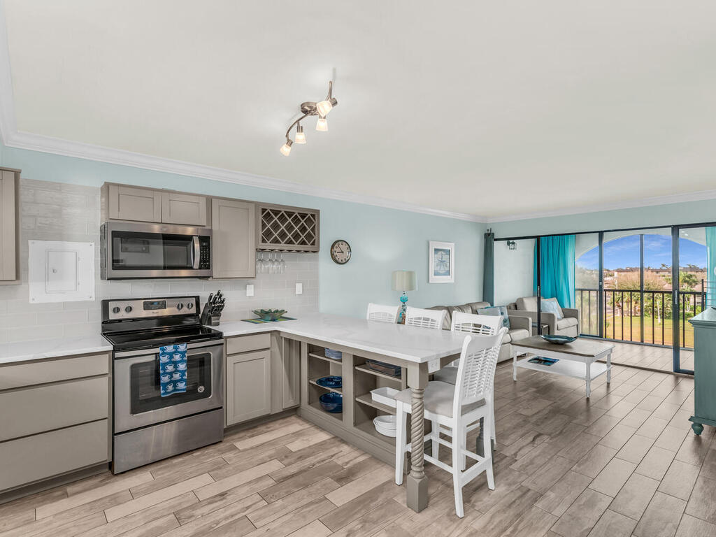 a large kitchen with a table and chairs