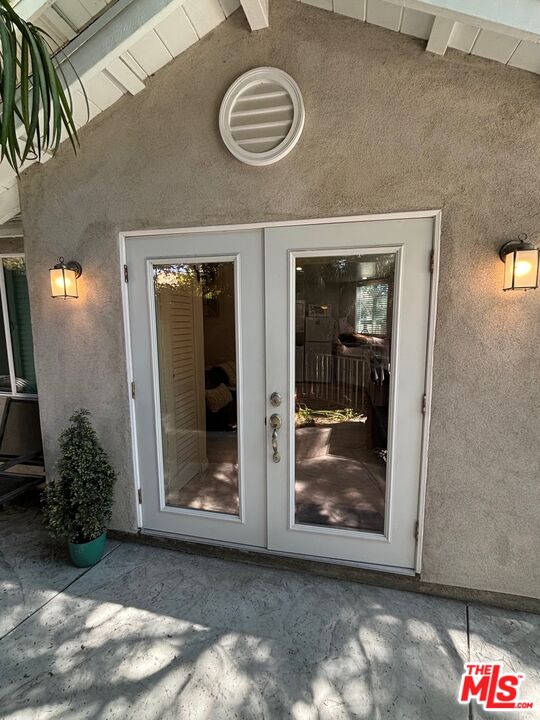 a view of a hallway with closet and front door