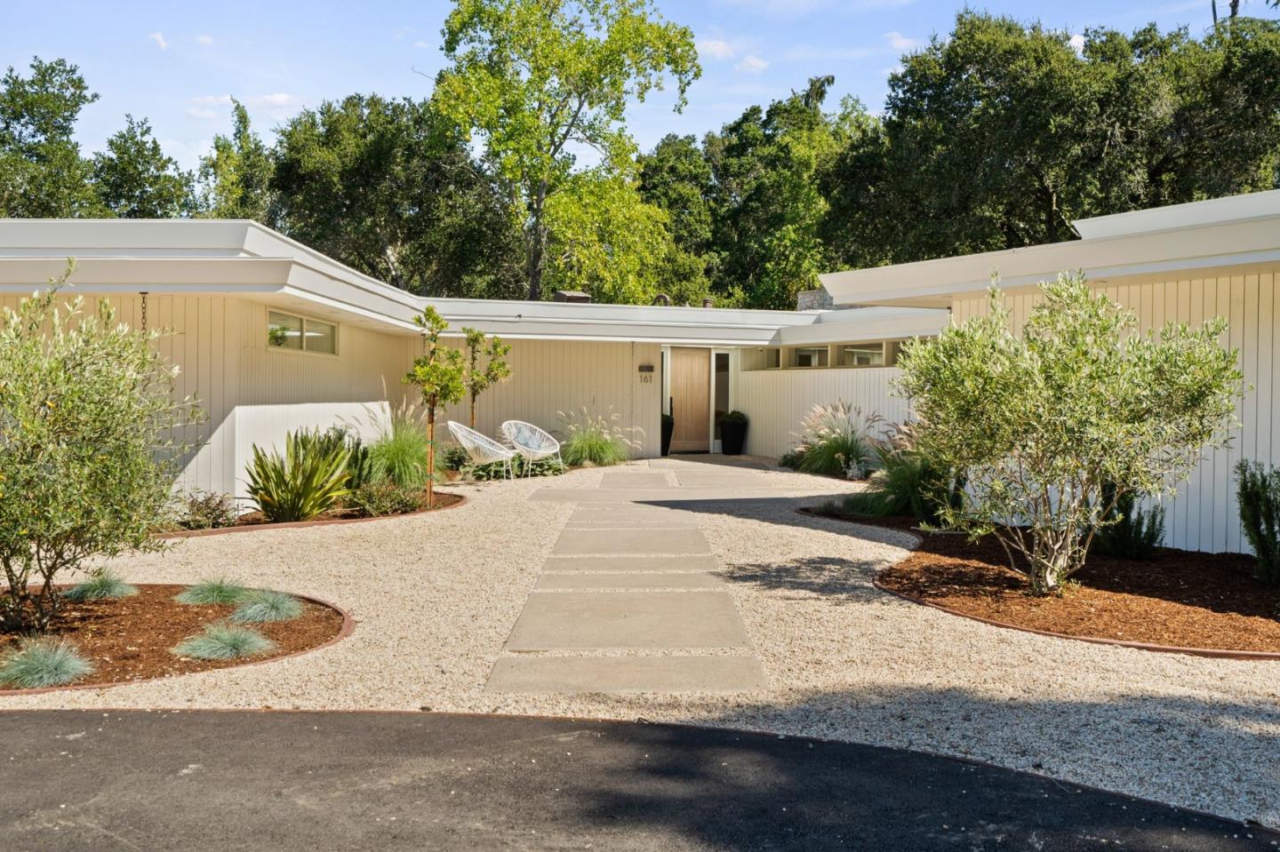 a side view of a house with a yard