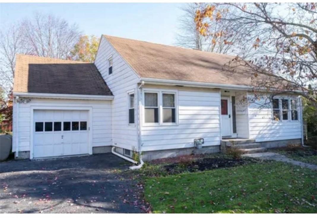 View of front of property with a garage