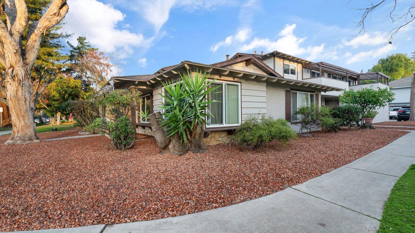 a front view of a house with garden