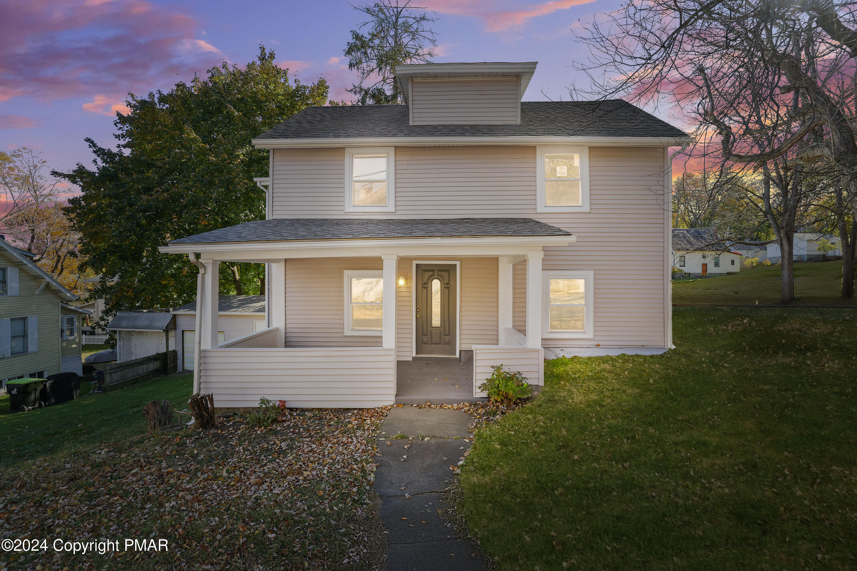 front view of a house with a yard