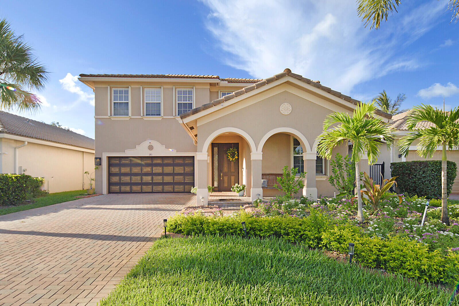 a front view of a house with garden