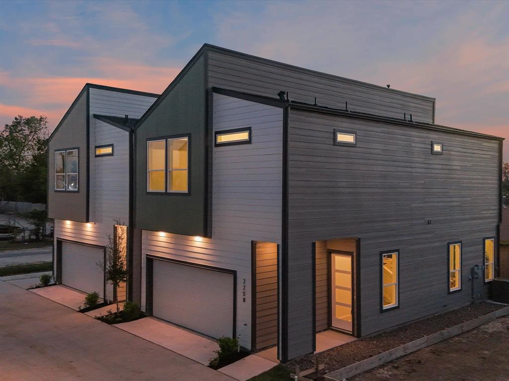 a front view of a house with garage