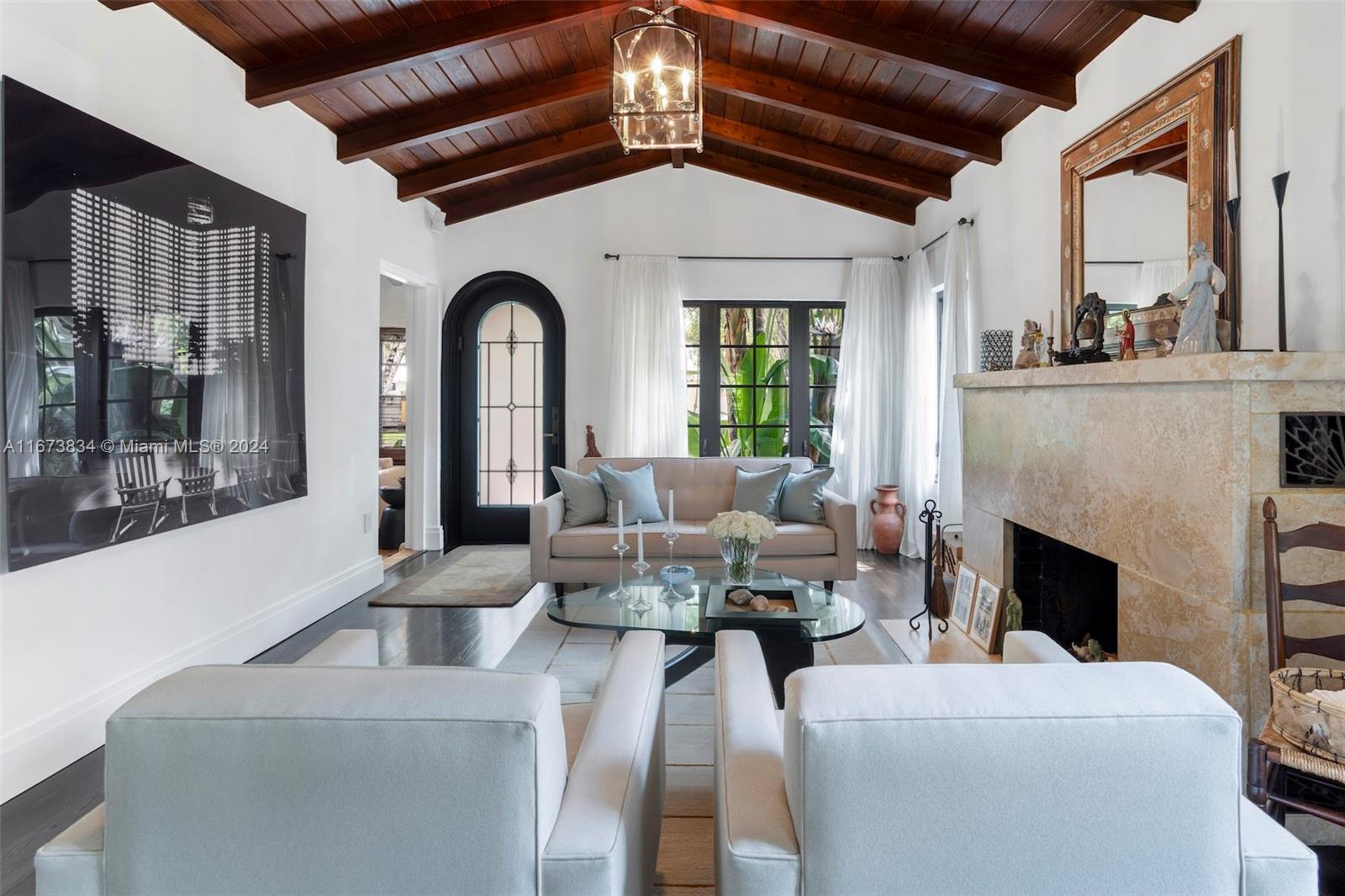 a view of a livingroom with furniture window and fireplace