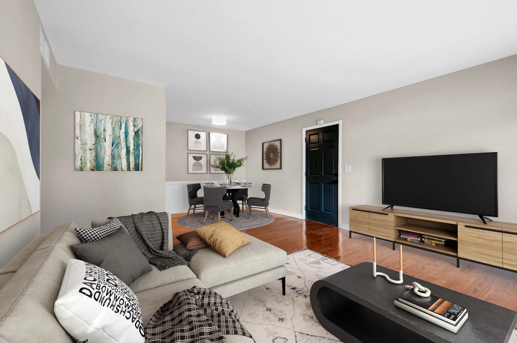 a living room with furniture and a flat screen tv