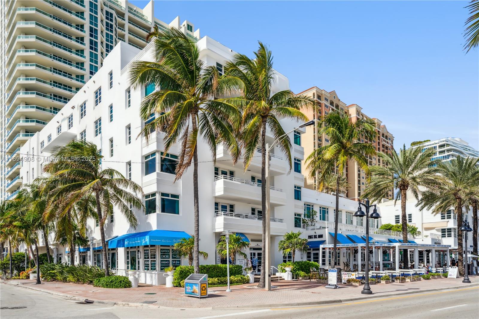 a view of a palm trees and a palm tree with a yard