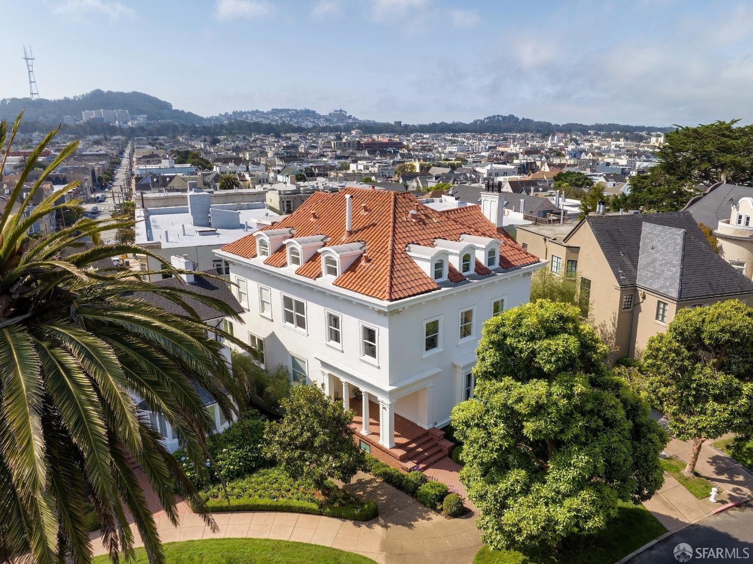 an aerial view of a residential apartment building with a yard