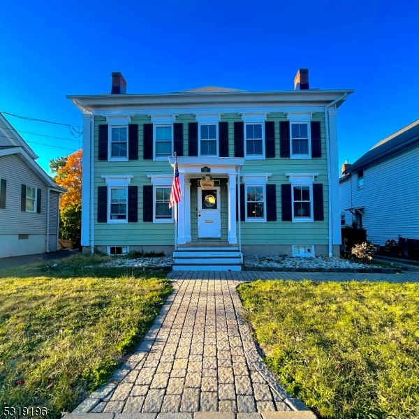 a front view of a house with swimming pool